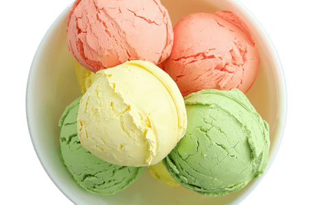 bowl-with-ice-cream-scoops-on-white-wooden-table-CMWPFEU-1.png